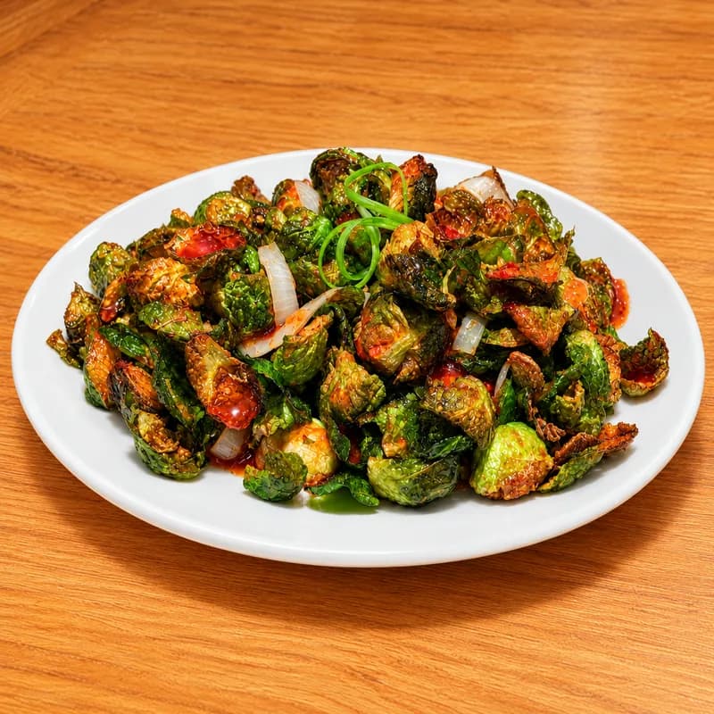 Crispy brussels sprouts glazed in sweet chili with scallion